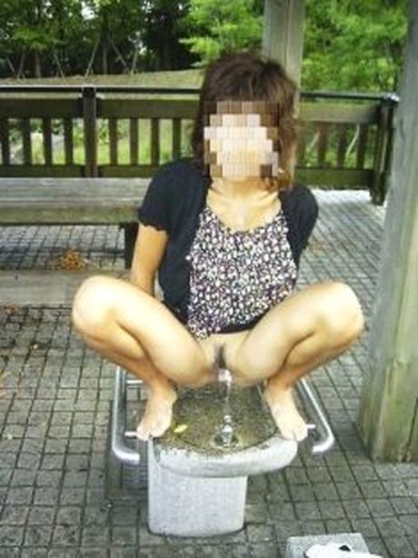 Asian amateur girl strips and shows her pussy in the public toilet