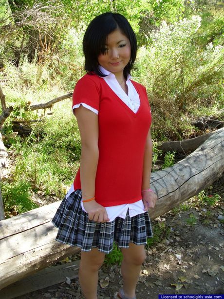 This chubby student flashes her big natural tits and her shaved slit outdoors