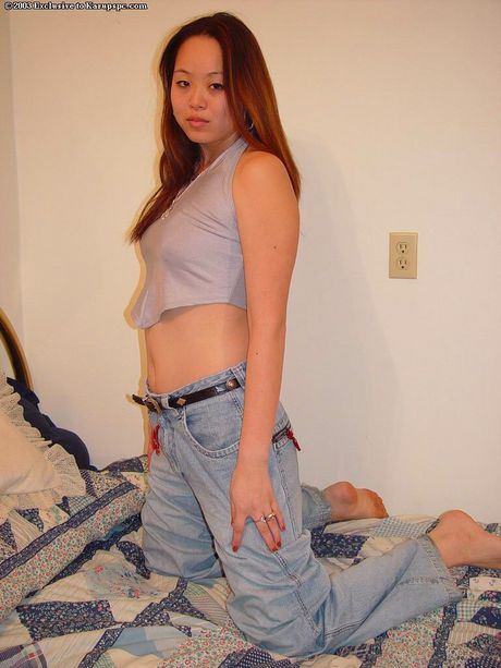Gracile oriental teen China in sexy jeans exhibiting her butt and cute pussy